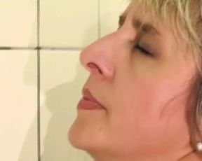 Wild German lady gets pissed and fucked in the bathroom by a long cock - SD - 27:01 video - from xHamster