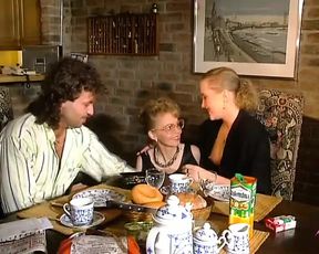 Two stunning German chicks sharing a loaded cock on the kitchen table - 17:24 video - from xHamster