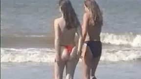 Two young blonde chicks walking on the sandy beach topless - 1:01 video - from MyLust