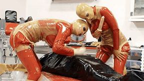 Two latex goddess and the slave catheterised in inflatable rubber - Part 2 of 2 - The catheter and the piss - SD - 14:36 video - from Clips4sale