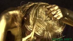 A beautiful woman is exercising with full body gold - 30:10 video - from FapHouse